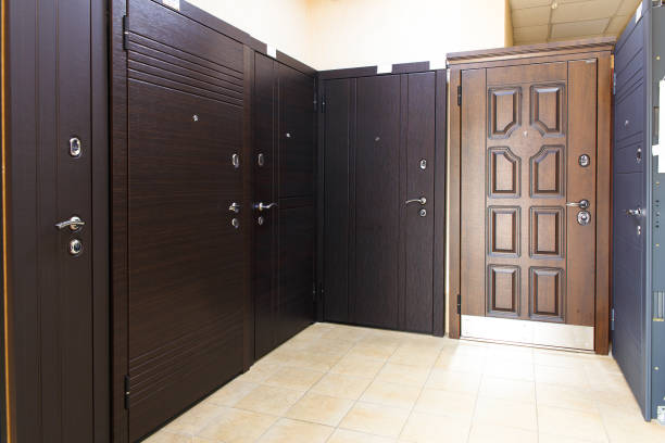 Entrance doors for sale in a specialized store. Buyers prefer metal doors